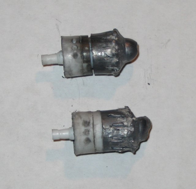 Two Brenneke slugs recoved from the wet catalog testing. Weight, Top: 110.9gr (97% retension), Bottom: 113.9gr (99.9% retension) Two Brenneke slugs recoved from the wet catalog testing. Weight, Top: 110.9gr (97% retension), Bottom: 113.9gr (99.9% retension)